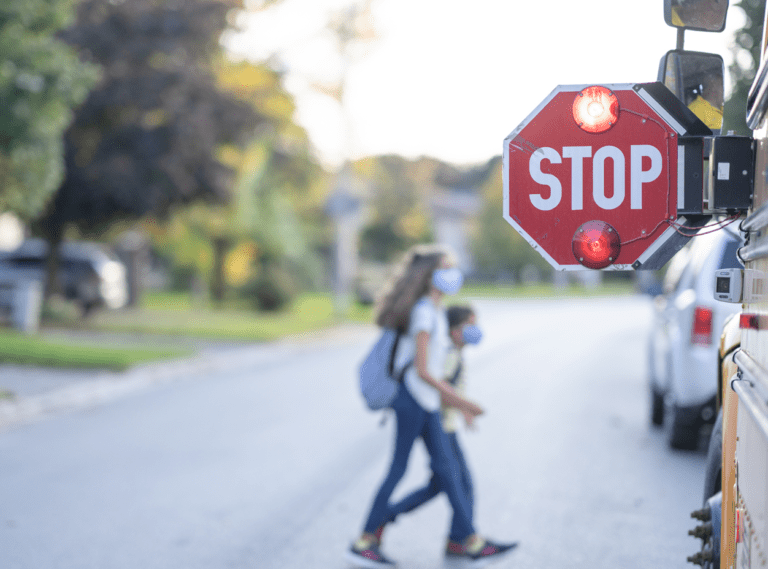 children boarding a school bus