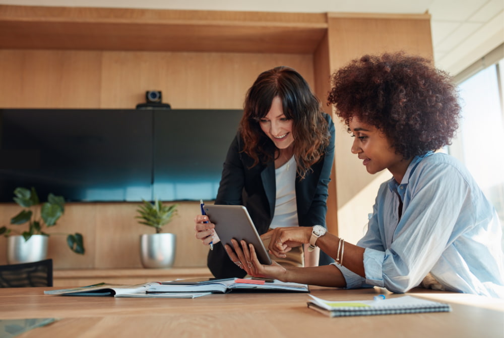 two women go over their individual coverage options offered by their employer