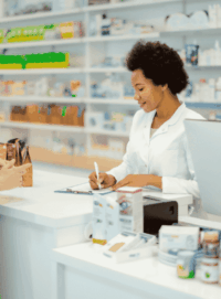 image of pharmacist and patient at pharmacy counter