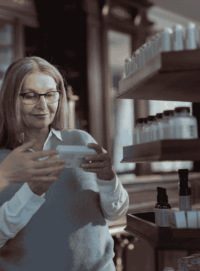 pharmacist explains prescription to patient or employee