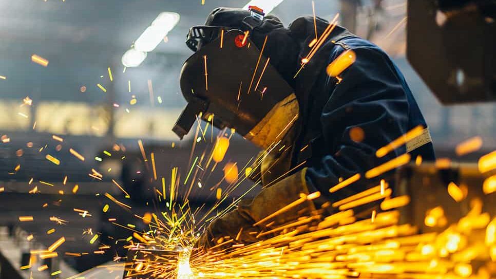 welding professional works on fabricating and manufacturing