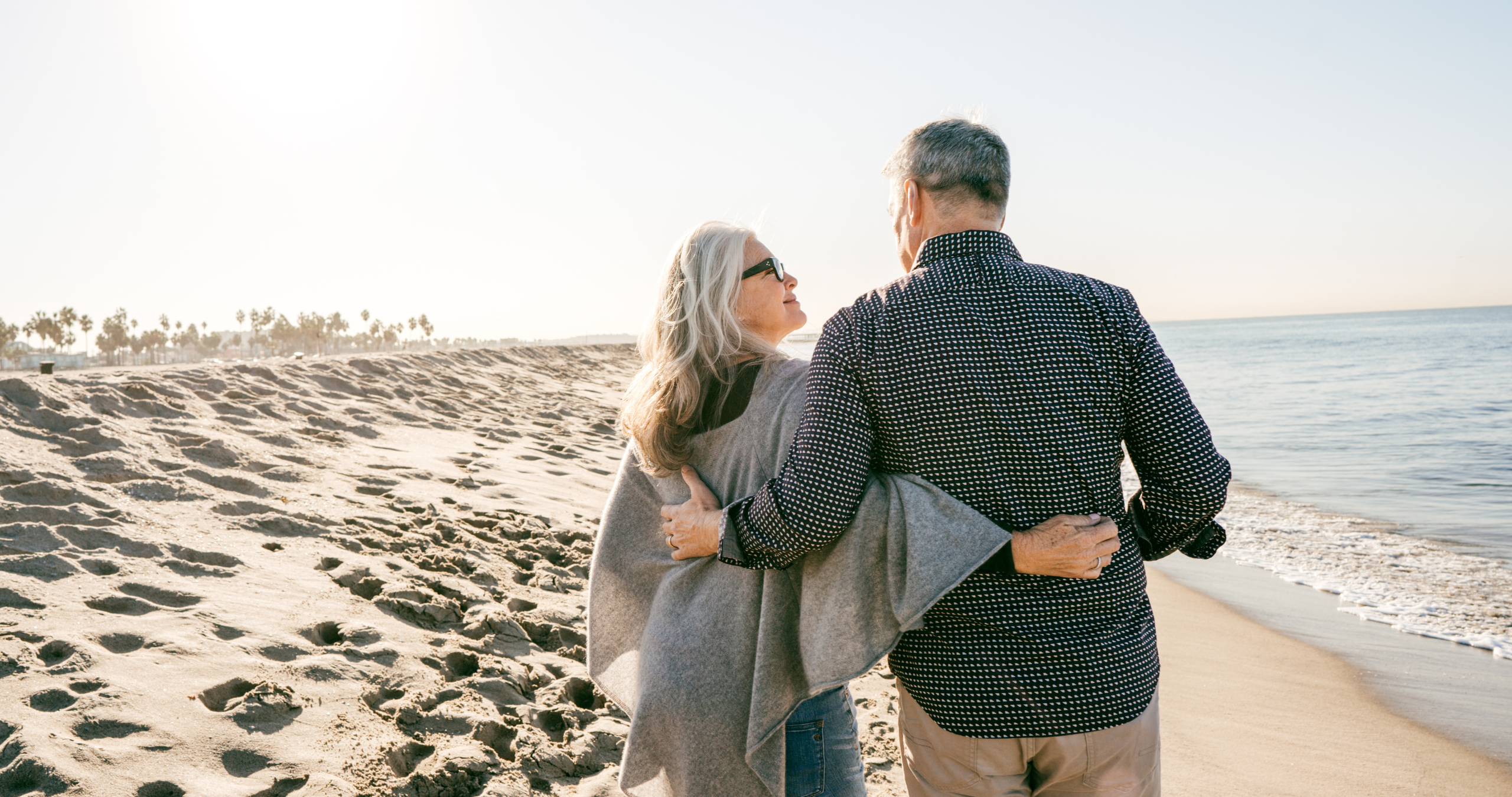 Couple walking on the beach together