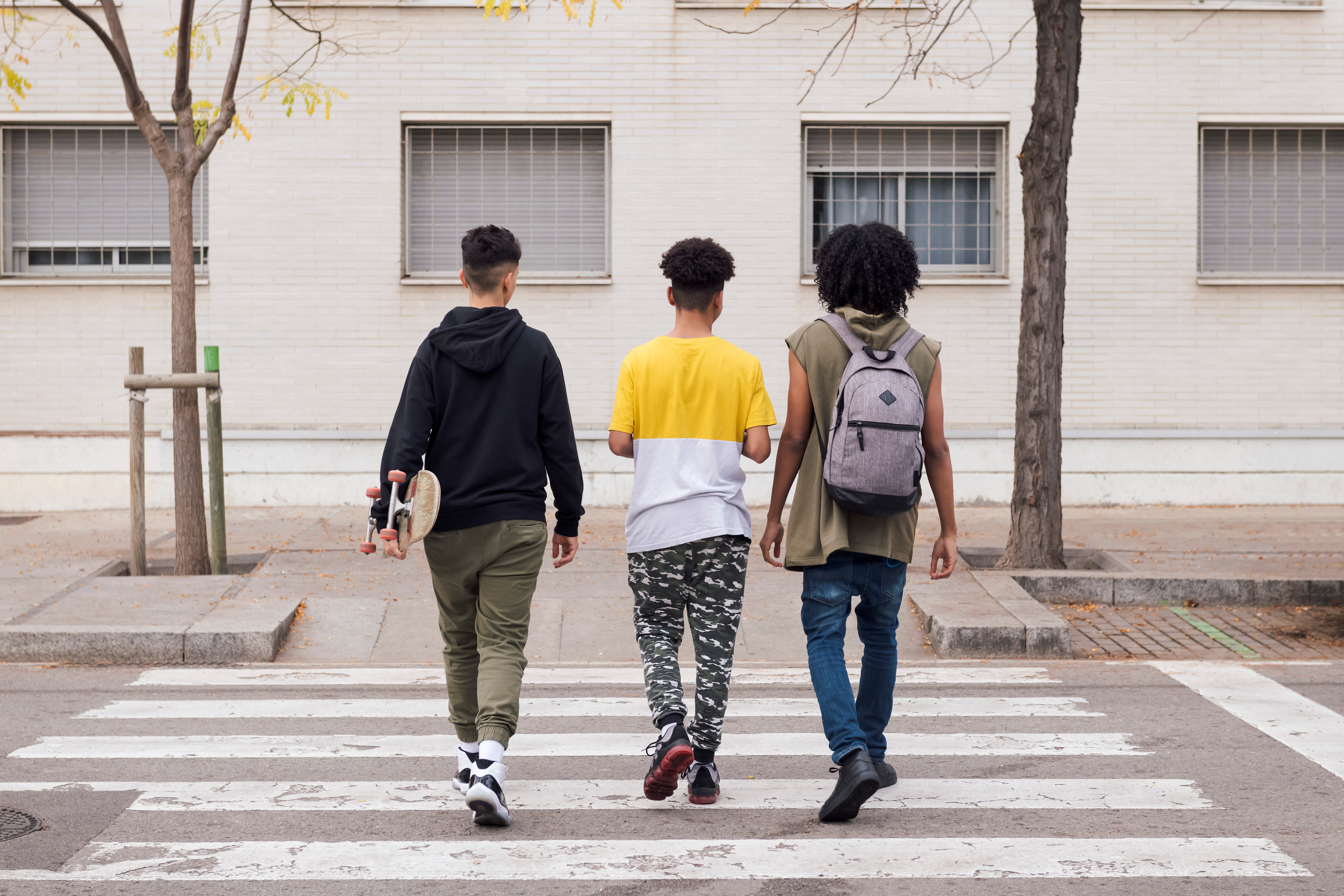 Students walking in a crosswalk